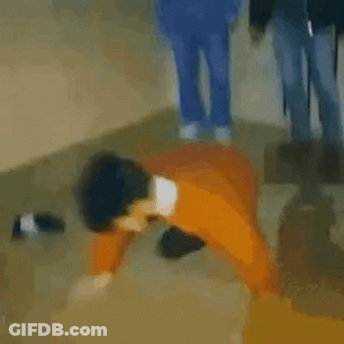 Blurry Man In Orange Jacket And Black Hat Dancing GIF