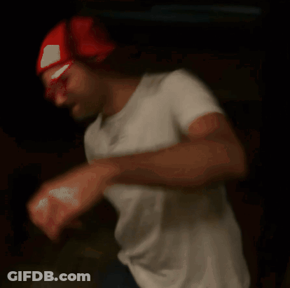 Blurry Man In Red Hat And White Shirt GIF