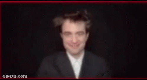Blurry Man In Suit And Bow Tie Smiling GIF