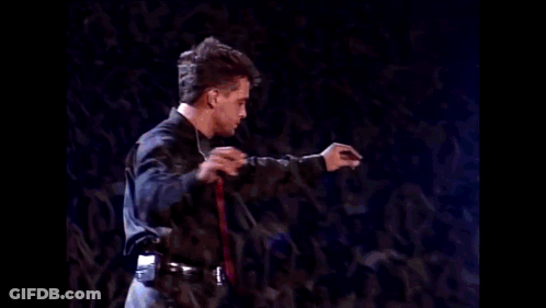 Blurry Man In Suit And Red Tie GIF