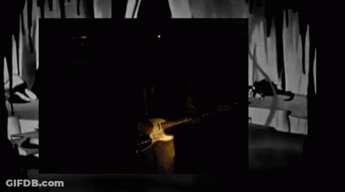 Blurry Man In Suit Standing In Dark GIF
