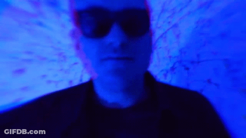 Blurry Man In Sunglasses With Blue Light GIF