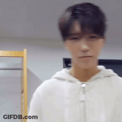 Blurry Man In White Hoodie GIF