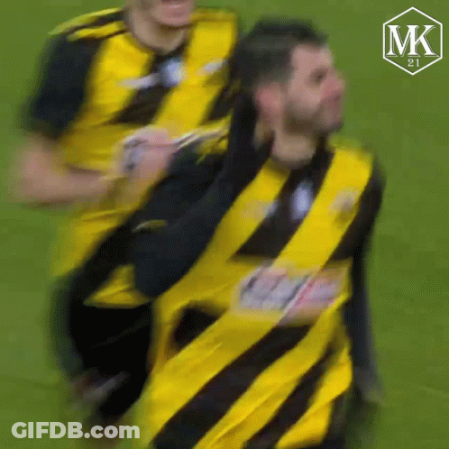 Blurry Man In Yellow And Black Striped Shirt GIF