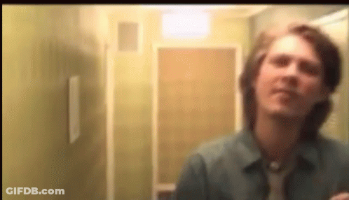 Blurry Man Looking In Mirror GIF