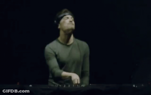 Blurry Man Playing Keyboard In Dark Room GIF