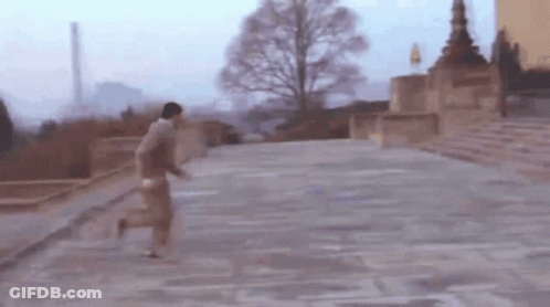 Blurry Man Running Down Staircase GIF