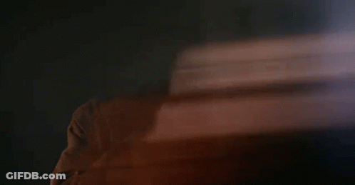 Blurry Man's Face In Dark Room GIF