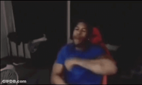 Blurry Man Sitting In Dark Room GIF