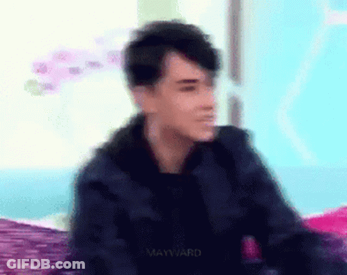 Blurry Man Sitting On Bed With Mayward GIF