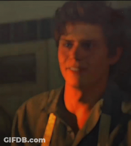 Blurry Man Standing In Crowd GIF