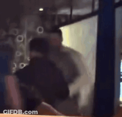 Blurry Man Standing In Front Of Window GIF