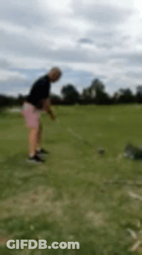 Blurry Man Swinging Golf Club GIF