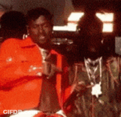 Blurry Man Wearing Necklace GIF