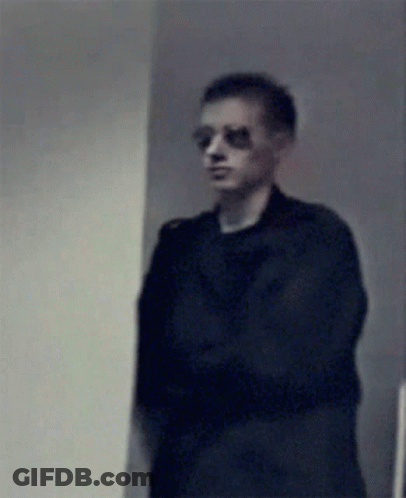 Blurry Man Wearing Sunglasses And Black Shirt GIF