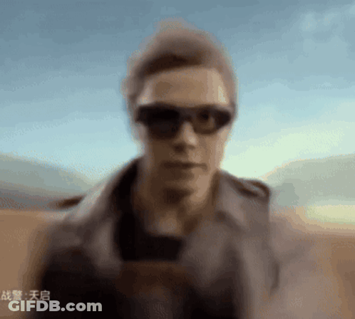 Blurry Man Wearing Sunglasses And Hat GIF