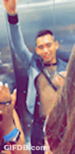 Blurry Man With Arm In Air GIF