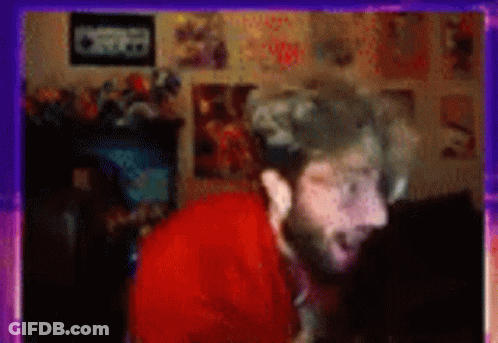Blurry Man With Beard In Room With Posters GIF