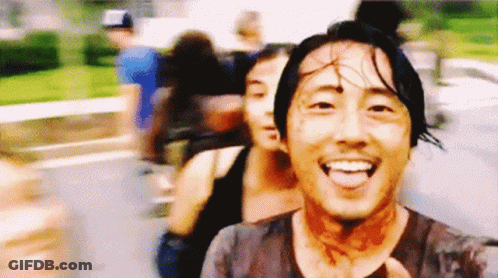 Blurry Man With Blood On Face Smiling GIF