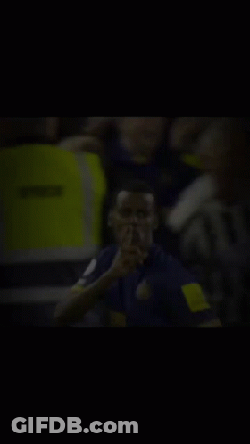 Blurry Man With Finger On Lips GIF