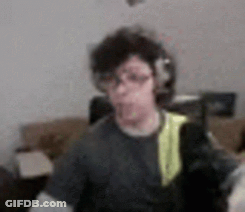 Blurry Man With Headphones And Backpack GIF