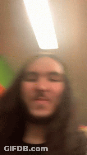 Blurry Man With Long Hair GIF