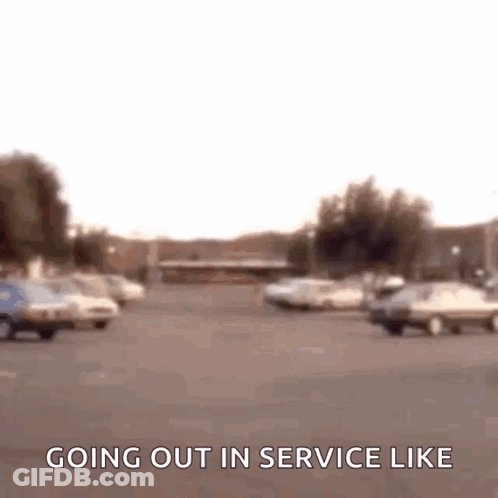 Blurry Parking Lot Sign Saying Going Out In Service Like GIF