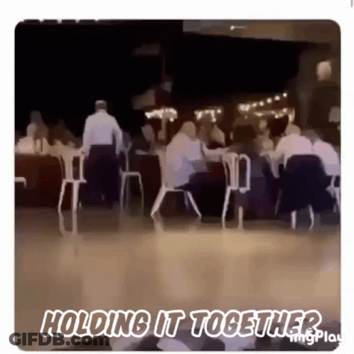 Blurry People Sitting At Tables Holding It Together GIF