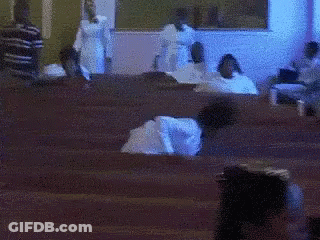 Blurry People Sitting In Church GIF