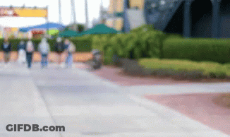 Blurry People Walking On Sidewalk GIF