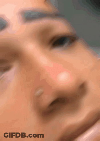 Blurry Person Face With Eyes Closed GIF