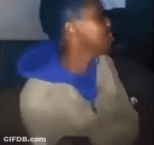 Blurry Person In Blue Shirt And White Jacket GIF