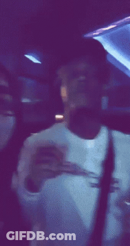 Blurry Person In Dark Room With Purple Lights GIF