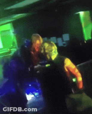 Blurry Person In Dark Room With Rainbow Colors GIF