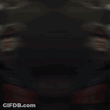 Blurry Person In Red And Blue Jacket GIF