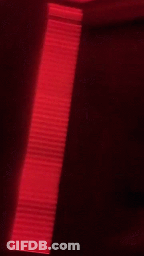 Blurry Person In Red Hat And Headband GIF