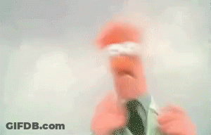 Blurry Person In Santa Hat Holding Bottle GIF