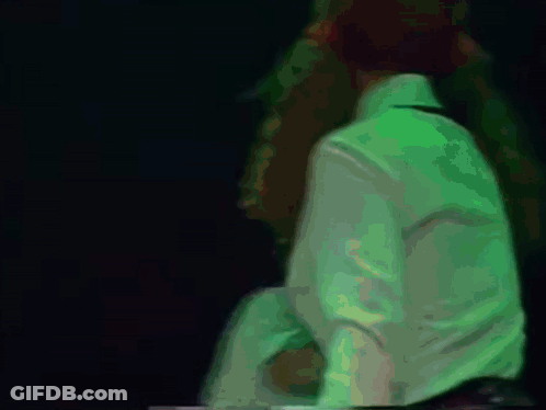 Blurry Person In White Shirt With Letter N GIF