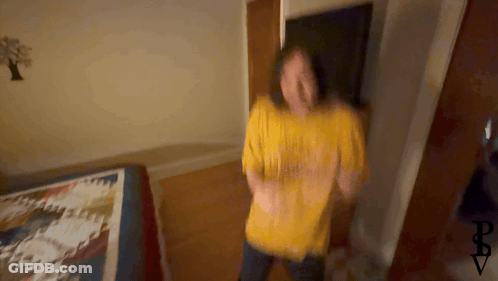 Blurry Person In Yellow Shirt Saying I Love You GIF