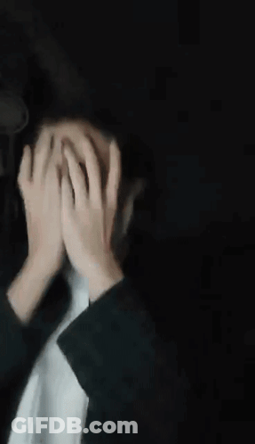 Blurry Person Making Funny Face Behind Glass Door GIF