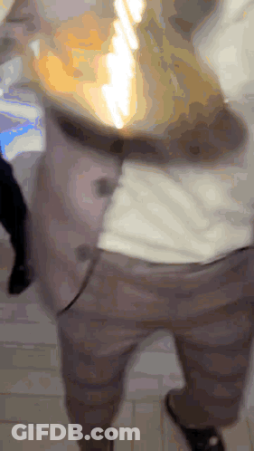 Blurry Person Pants And White Shirt GIF