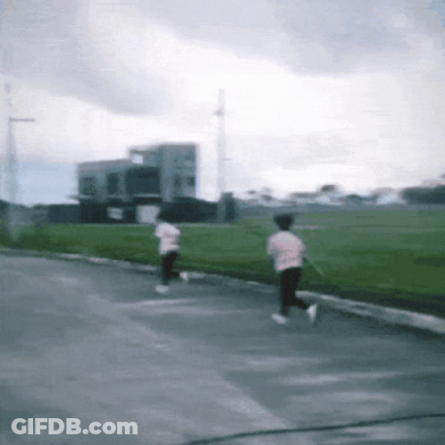 Blurry Person Running Down Street GIF