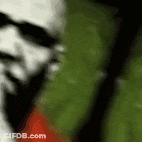 Blurry Person's Face Green And Red Background GIF