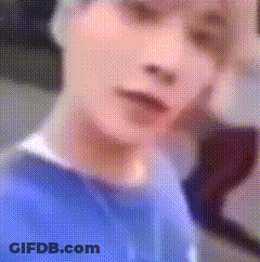 Blurry Person's Face In Blue Shirt GIF