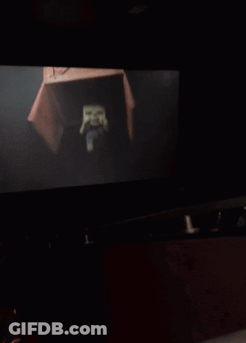 Blurry Person's Face With Yellow Light GIF