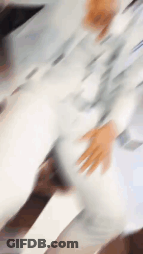 Blurry Person's Hands On Table GIF
