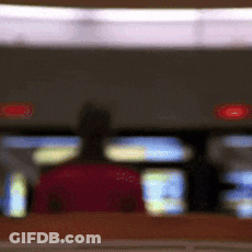 Blurry Person Sitting In Red Chair GIF