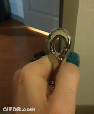 Blurry Person Sitting On Bed With Remote Control GIF