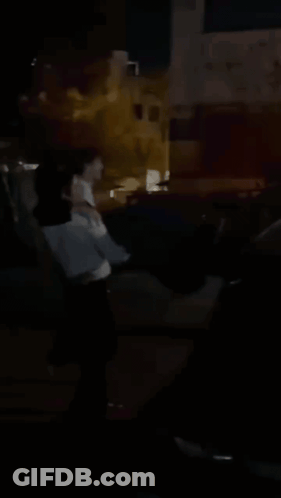 Blurry Person Standing In Dark GIF