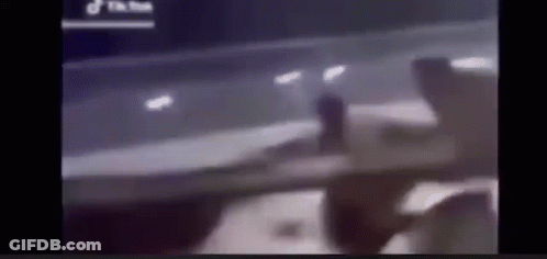 Blurry Person Standing In Front Of Car GIF